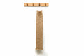 Jute rope hanging on a wooden hook against a white wall with plants.